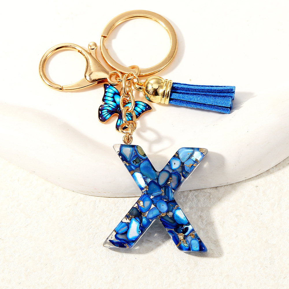 Nuevo transfronterizo mariposa 26 letras inglesas de cristal goteo llavero bolsos accesorios colgante de automóviles