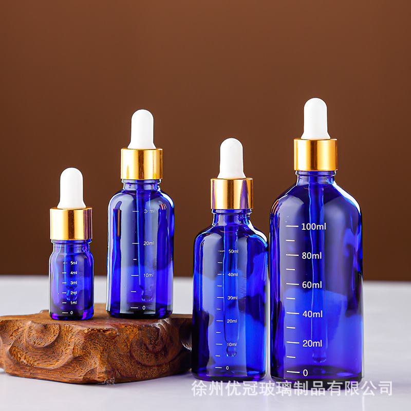 En stock Botella de aceite esencial marrón Botella cuentagotas de 10ml Botella vacía Botella cosmética de vidrio azul Botella secundaria de escala de 30ml