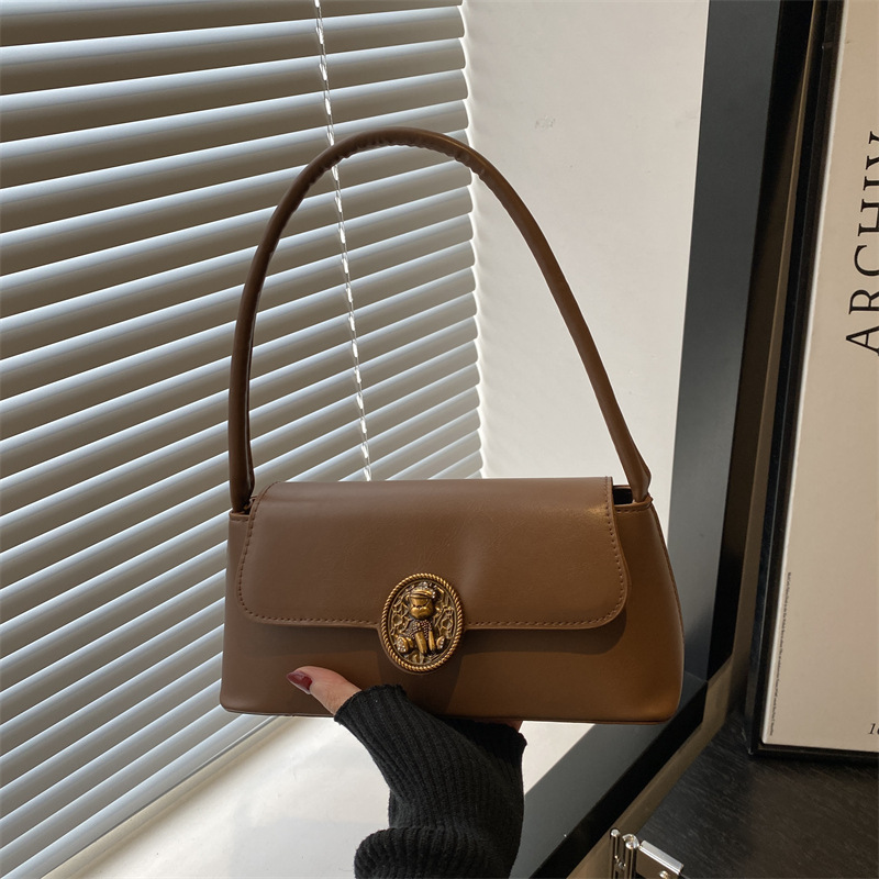 Bolsos retro de estilo extranjero para mujeres otoño y invierno 2024 nueva moda literaria bolsas de brazo de diseño de nicho bolsas de hombro