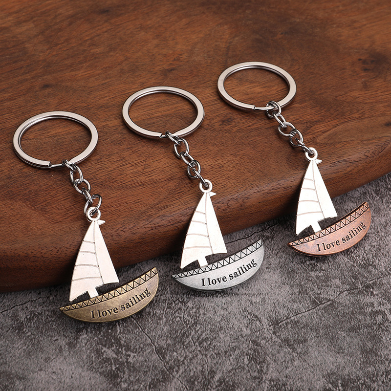 Fashion sailing couple keychain bag ornaments metal car pendant smooth air meaning key chain gift