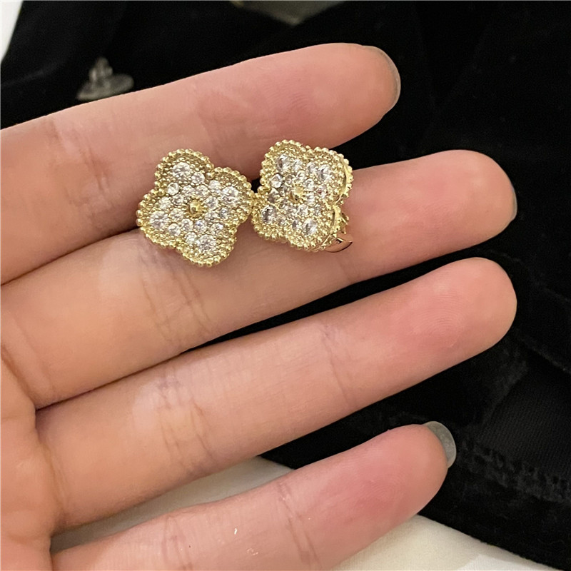 Korean Style C-shaped Gold Plated Four-petal Flower Micro-inlaid Earrings display picture 8