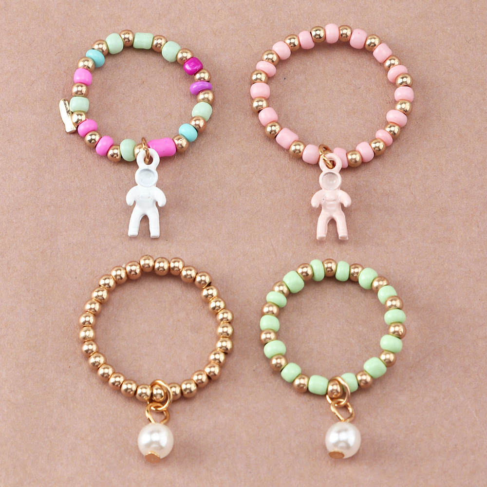 Simple Creative Spaceman Ring Color Rice Bead Elastic Tail Ring Set Ring display picture 3