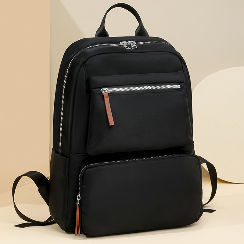 2025 nueva mochila de nailon casual para mujer, simple y versátil, mochila de viaje ligera de gran capacidad, mochila escolar para estudiantes