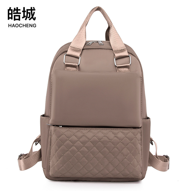 Fabricantes al por mayor 2023 nuevas damas casuales Oxford mochila moda simple al aire libre rombo mochila portátil marea