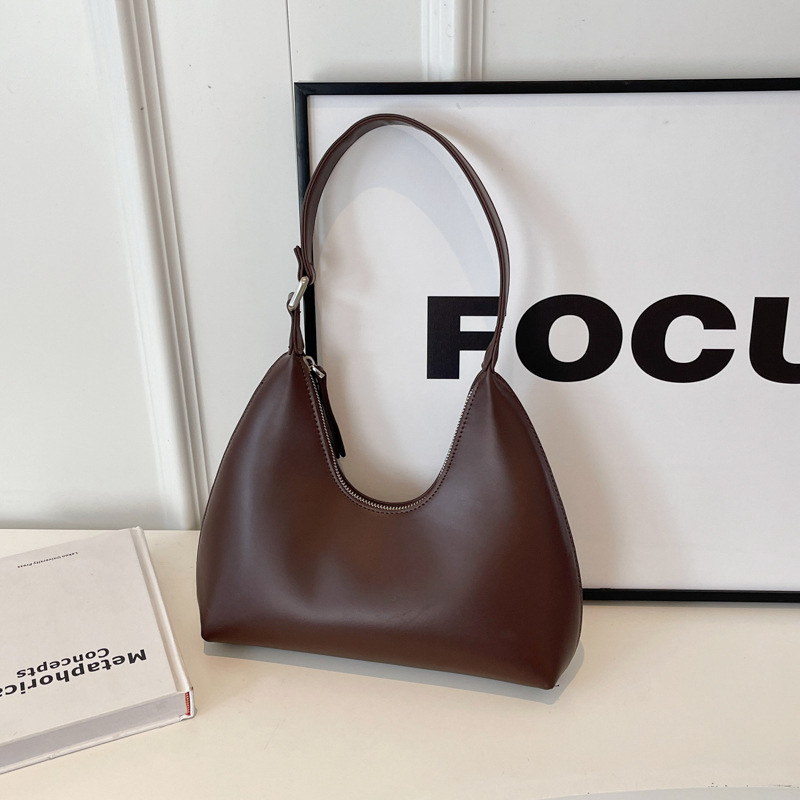 Axilas femininas 2024 novas em formato de crescente minimalista com temperamento versátil, viagens casuais, textura portátil,_voghion.com