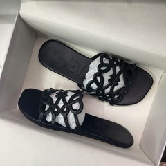 Luojia の新しい本革中空フラットサンダル、女性用ビーチローマンシューズ、スリッパ、ファッショナブルなカジュアルサンダル