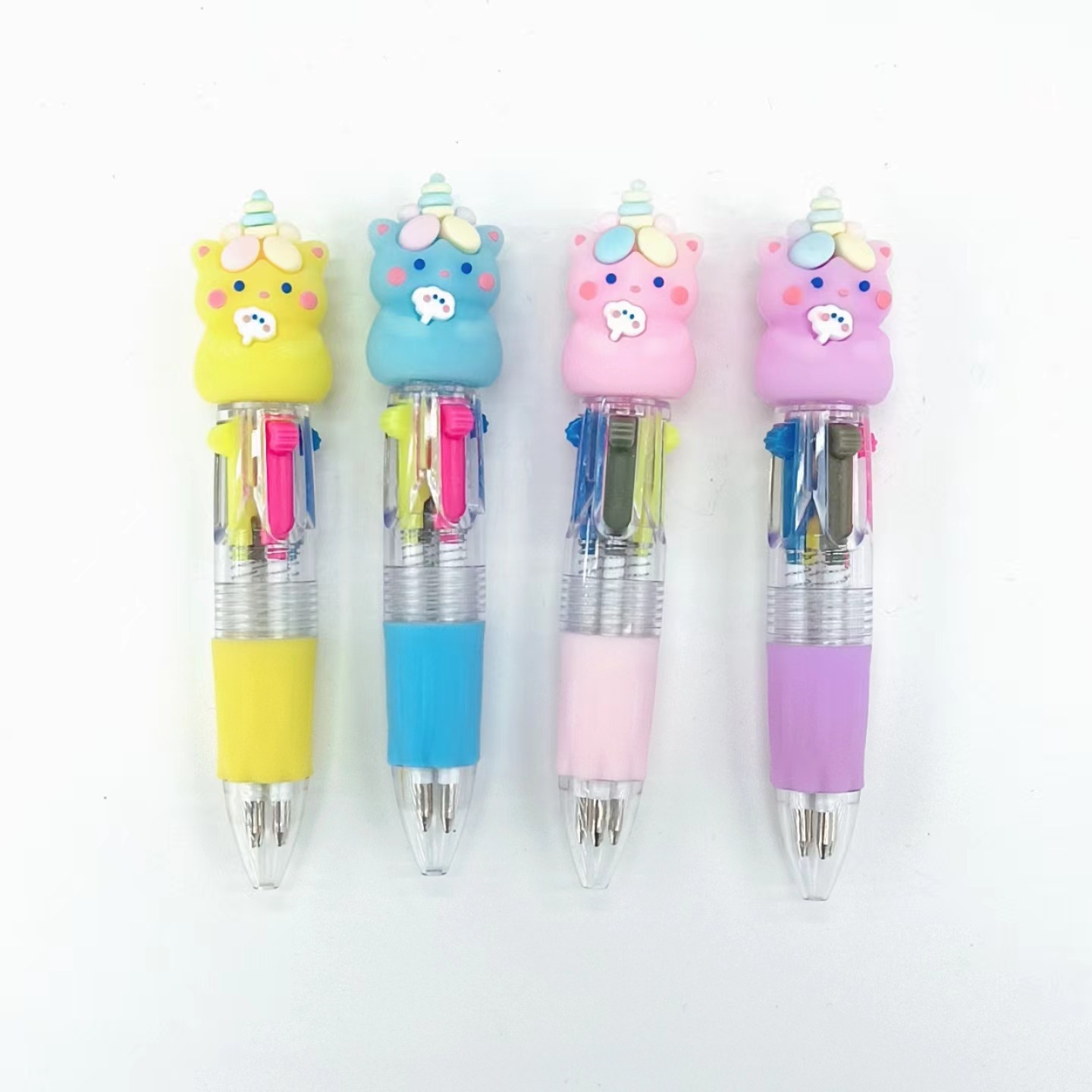 Fabricante mayorista de cuatro colores bolígrafo de silicona bolígrafo multicolor de dibujos animados cabeza portátil de estudiantes