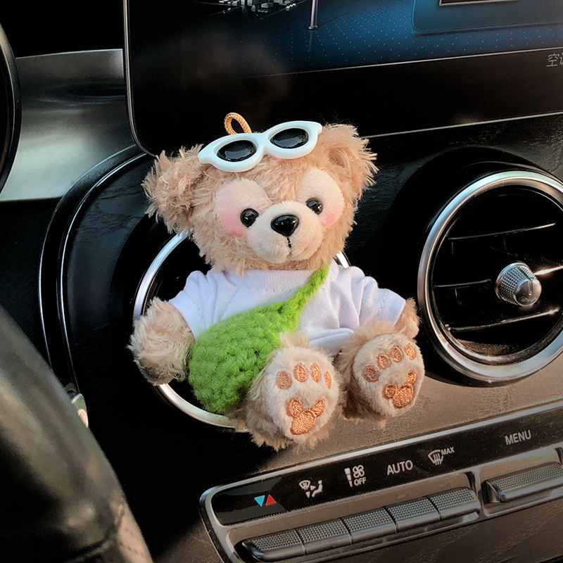 2025 nuevo coche muñeca oso de felpa Tamiflu coche aromaterapia de salida de aire decoración interior accesorios de coche decoración mujer