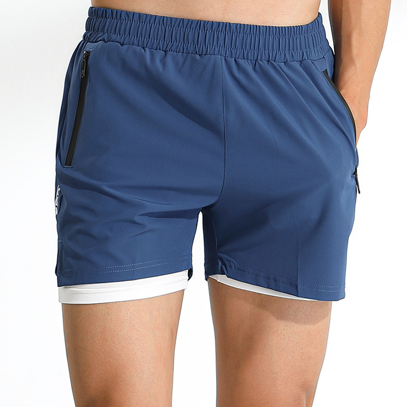 Los hombres de verano corriendo pantalones de tres puntos falsos de dos piezas de deportes casuales pantalones cortos de entrenamiento de fitness de doble capa transpirables de secado rápido en stock