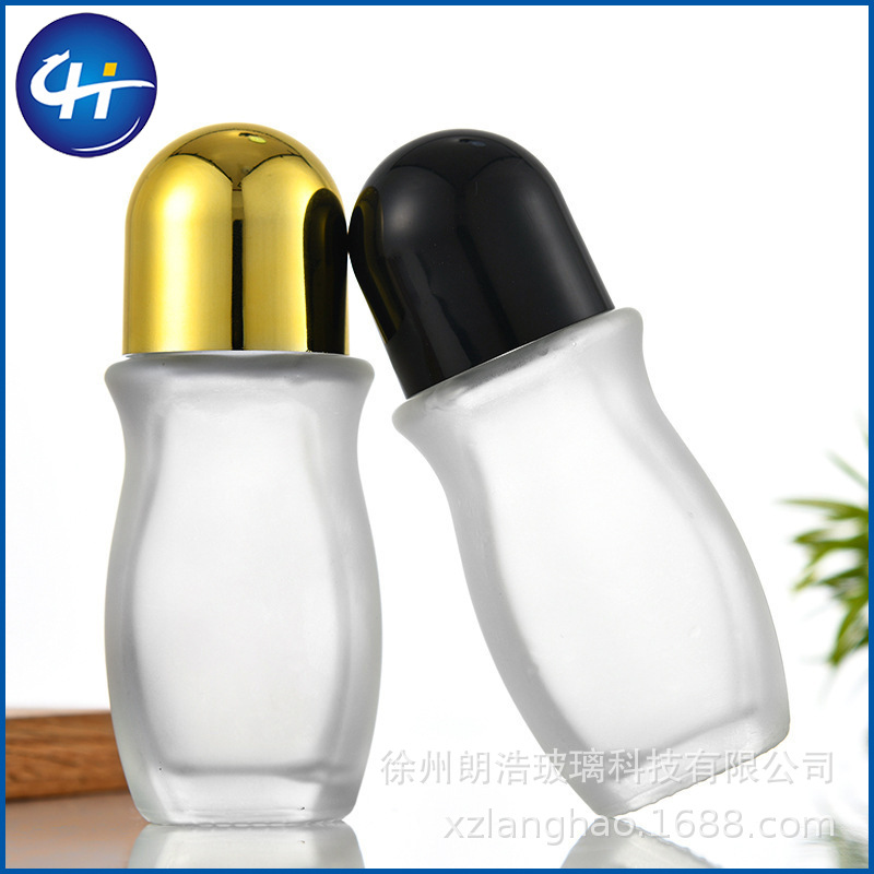 Venta al por mayor de vidrio transparente 50ml botella de bola de rodillo 30ml aceite esencial aceite de medicina cuerpo masaje botella de cuentas dolor botella grande