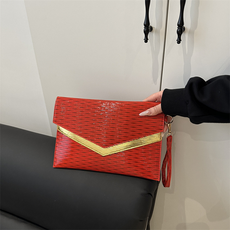 Bolso de sobres de mano de tendencia transfronteriza 2025 primavera nuevo estilo coreano personalidad moda casual temperamento color de contraste bolso de banquete