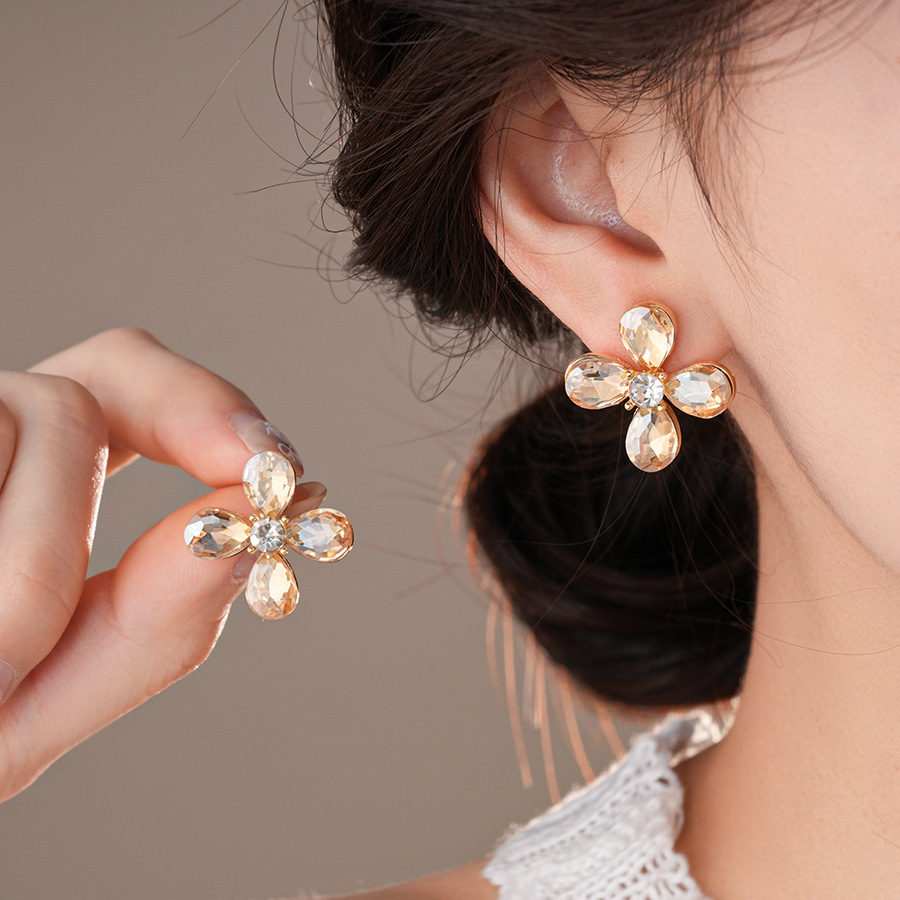 Pendientes de flor de lazo elegante de súper hada de plata Pendientes de moda de lujo ligero francés Pendientes de todo fósforo dulce de estilo literario