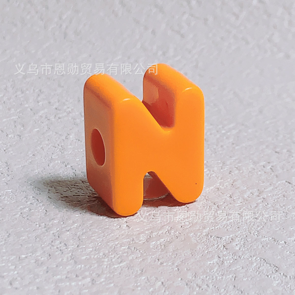 N (Orange)