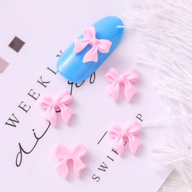 Mariposa de uñas popular repujado arco resina pajarita joyería simple todo partido tridimensional hueco decorativo diamante