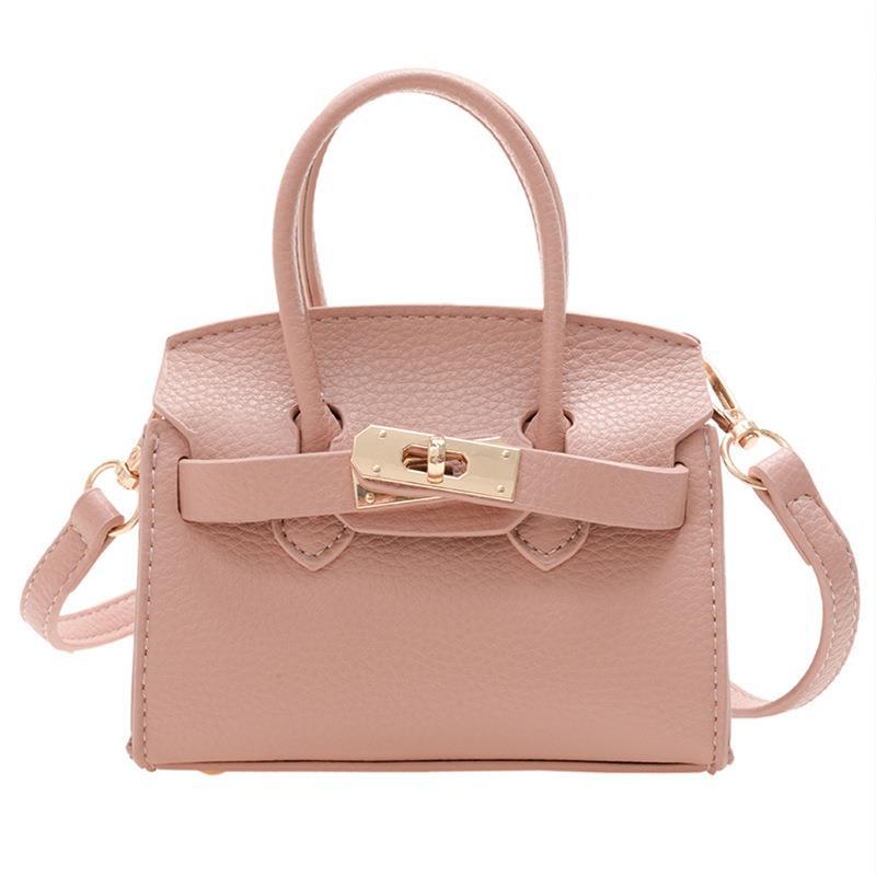 Bolsa para niños nueva pasarela europea y americana moda bolsa de platino estilo occidental niña bolsa de mensajero forma cóncava monedero comercio exterior