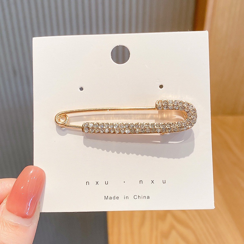 La cintura de los jeans se cambia a un botón de cintura pequeño, broche, falda de mujer, ajuste de cintura, dispositivo de ajuste, alfiler, botón anti-luz fijo