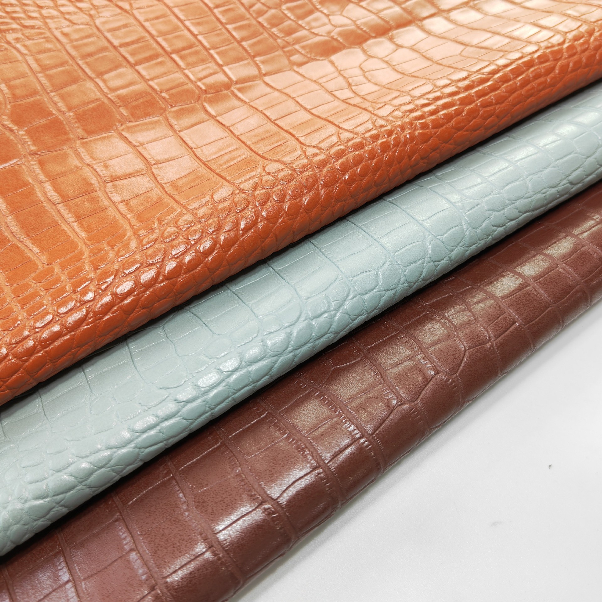 厂家直销新款手袋箱包皮革面料 环保鳄鱼纹石头纹PVC人造革  现货