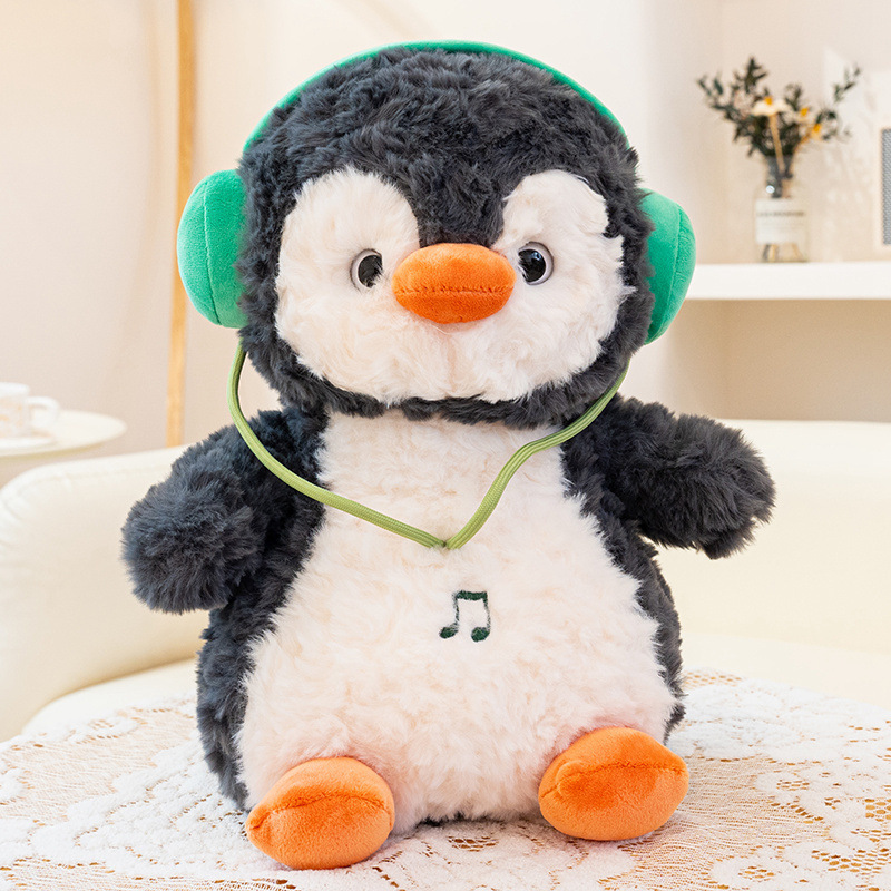 Muñecas de pingüino dinámicas transfronterizas auriculares muñecas de peluche muñecas de música muñecas de pingüino pacificador muñeca almohada