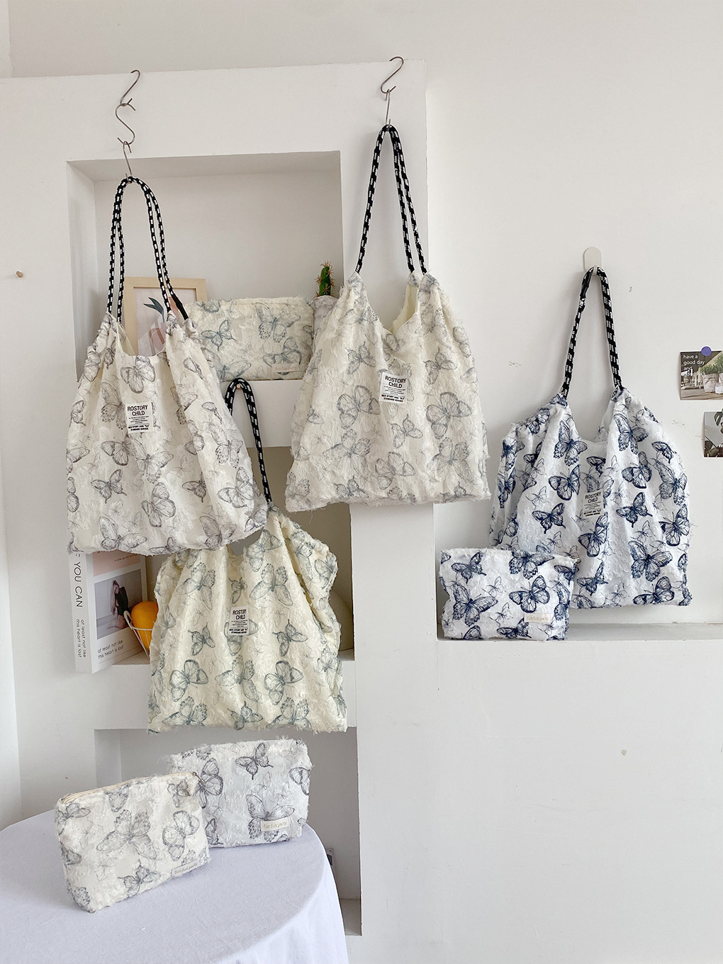 Bolso de mariposa de encaje para niña, bolso de hombro de diseño de nicho fresco de principios de primavera, paquete combinado, bolso de tela ligero Tote de viento perezoso