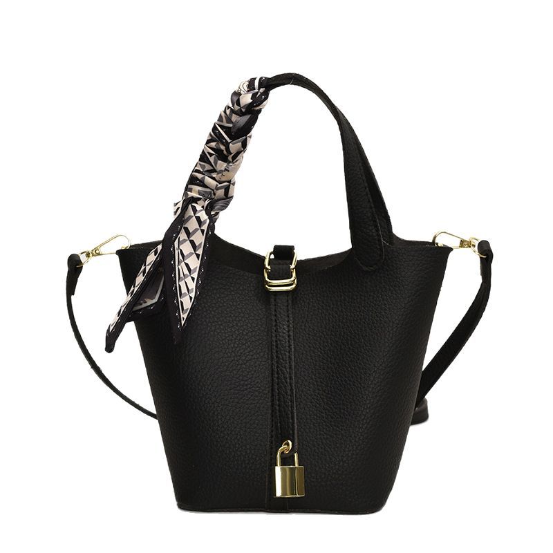 2025 nueva versión coreana de la bolsa de cubo portátil de nicho, moda femenina, bolsa de mensajero explosiva, bolso de hombro de todo fósforo de cercanías