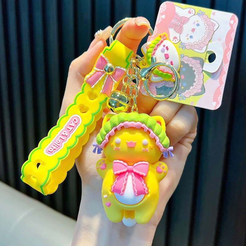 Keychain dinosaurio auténtico lindo bolso colgante de goma blanda llavero de automóvil muñeca pequeña máquina de regalos al por mayor image 14
