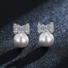 Zirconium with bow from pearl, small cute earrings, Korean style, simple and elegant design, internet celebrity, light luxury style