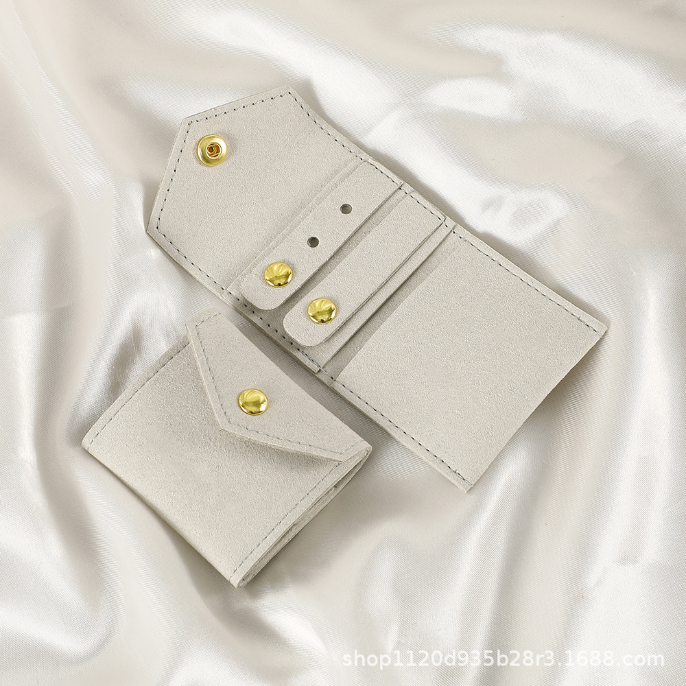 Spot microfibra portátil multifuncional mini joyería rollo de joyería pendiente anillo pendiente collar bolsa de protección de almacenamiento