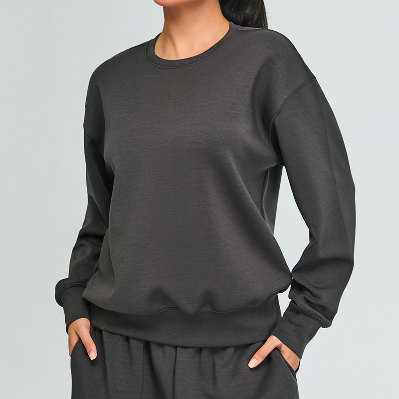 Otoño e invierno nuevo estilo modal suéter deportivo ropa de fitness top mujer al aire libre suelta casual adelgazante ropa de yoga de manga larga