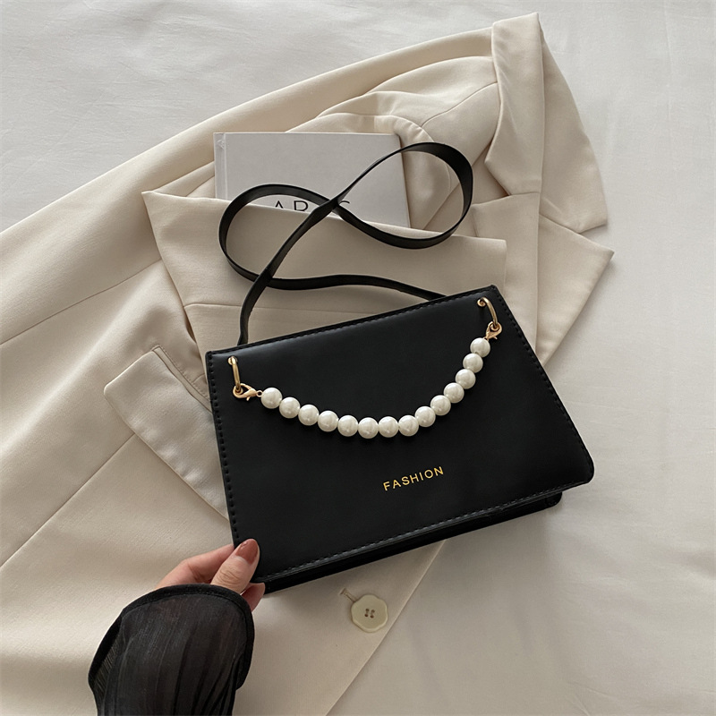 Bolso de nicho de sentido de alta gama para mujer 2024 nuevo bolso de hombro de cadena de perlas de moda salvaje bandolera bandolera