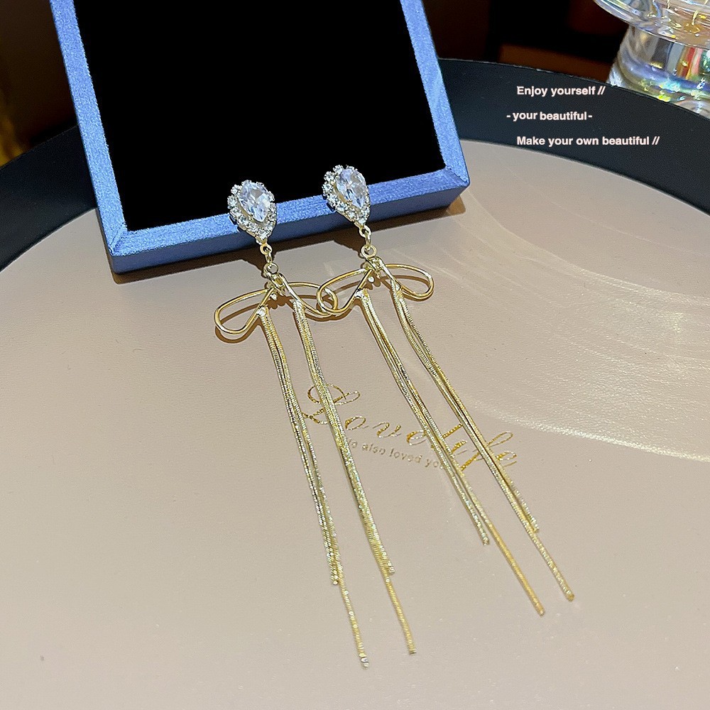 S925 aguja de plata elegante borla pendientes de alta gama simple cara de adelgazamiento pendientes de todo fósforo estilo coreano nuevos pendientes de moda al por mayor