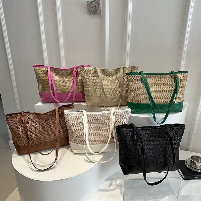 Paja trenzada bolsa 2025 nueva personalidad ins bolsa trenzada de aire extranjero playa simple textura de color de choque bolso de hombro de mujer