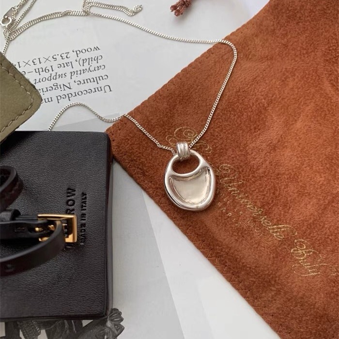 about nice same style South Korea niche saddle bag necklace simple irregular pendant long sweater clavicle chain