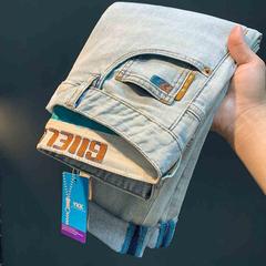 ヨーロッパ駅の高級ブルーストレッチジーンズ男性修身ビジネスカジュアルヨーロッパ商品の新型男性ズボン2025年