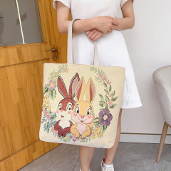 卸売りの新型両面金糸ジャカード刺繍ウサギ象孔雀片肩包民族風手提げ通勤バッグ
