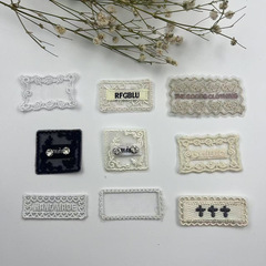 新しいネットの底の布は刺繍の花を貼ってアルファベットのレースの靴の帽子の服のセーターの靴下の補助材料の服装の装飾を貼ります。