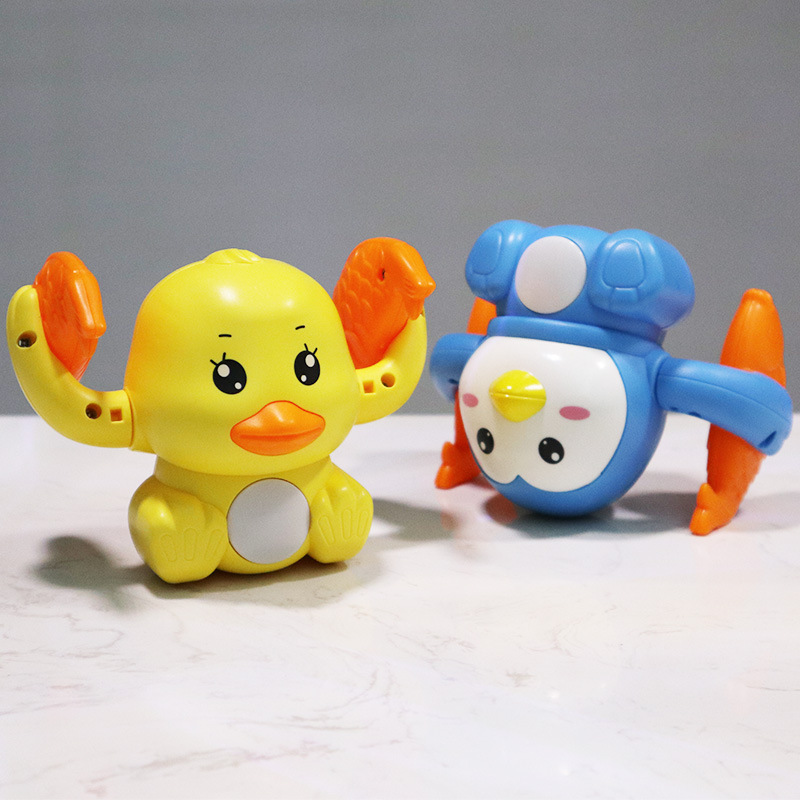 Envío gratuito transfronterizo caminando Flip cubo dibujos animados lindo pato juguete eléctrico para niños música de iluminación controlada por voz TikTok puesto
