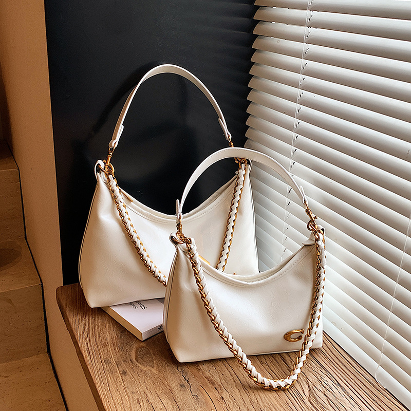 Bolso de alta sensación de mujer 2025 nuevo nicho de cadena brazaleta bolso súper caliente universal bolso de hombro