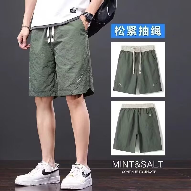 Camisas, menos ropa, pantalones de verano de cinco puntos, holgados y cómodos, todo-fósforo, pantalones casuales de estilo de Hong Kong, deportes para hombres, hombres estadounidenses, de secado rápido