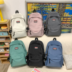 2025 新しいシンプルなカジュアルバックパックカップルスタイル日本イン軽量バックパック中学生スクールバッグ