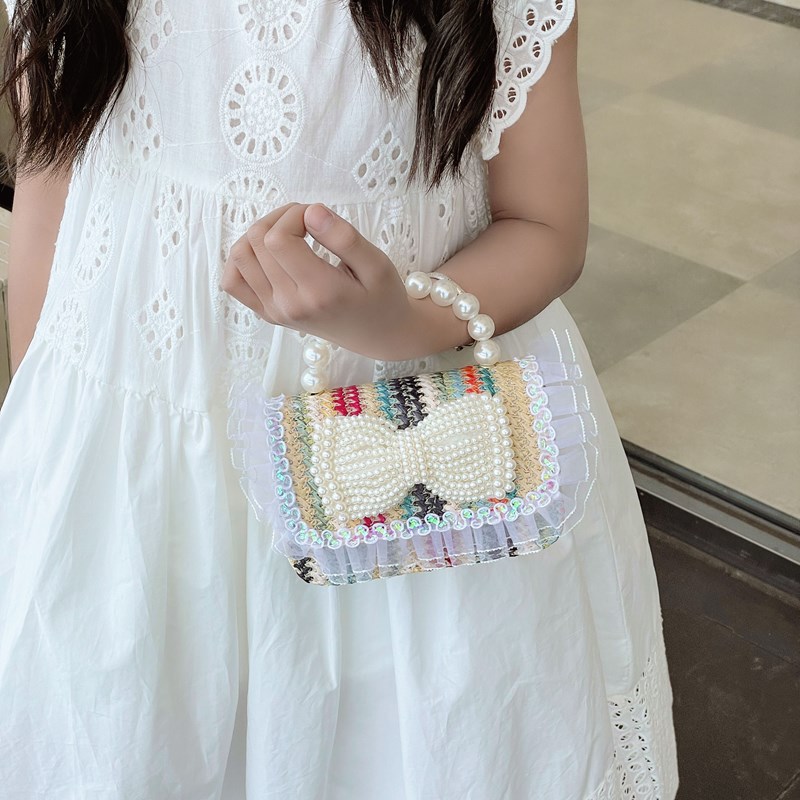2025 nuevo regalo para niñas para niñas jardín de infantes Día de los niños arco de perla tela de paja bolso de hombro