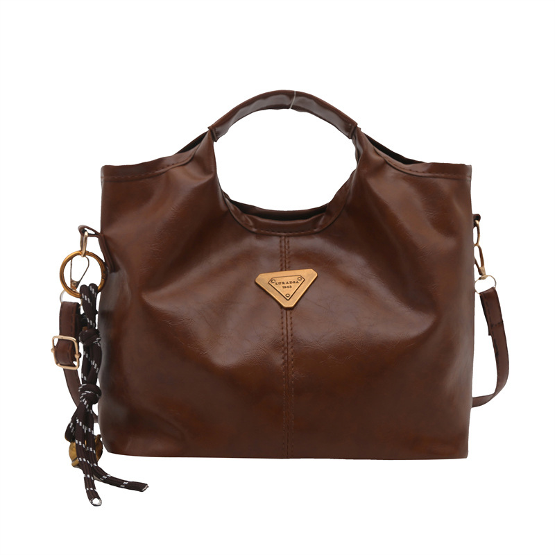 Bolso de mano retrógrado nicho mujer 2025 nuevo estilo de piel de cera de aceite para viajar bolso de hombro de gran capacidad relajado mochila