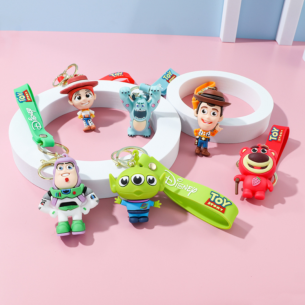 Llavero de silicona de Toy Story, el popular dibujo animado, con personajes como el alienígena de tres ojos, Buzz Lightyear y el oso Lotso, ideal como adorno para bolso.