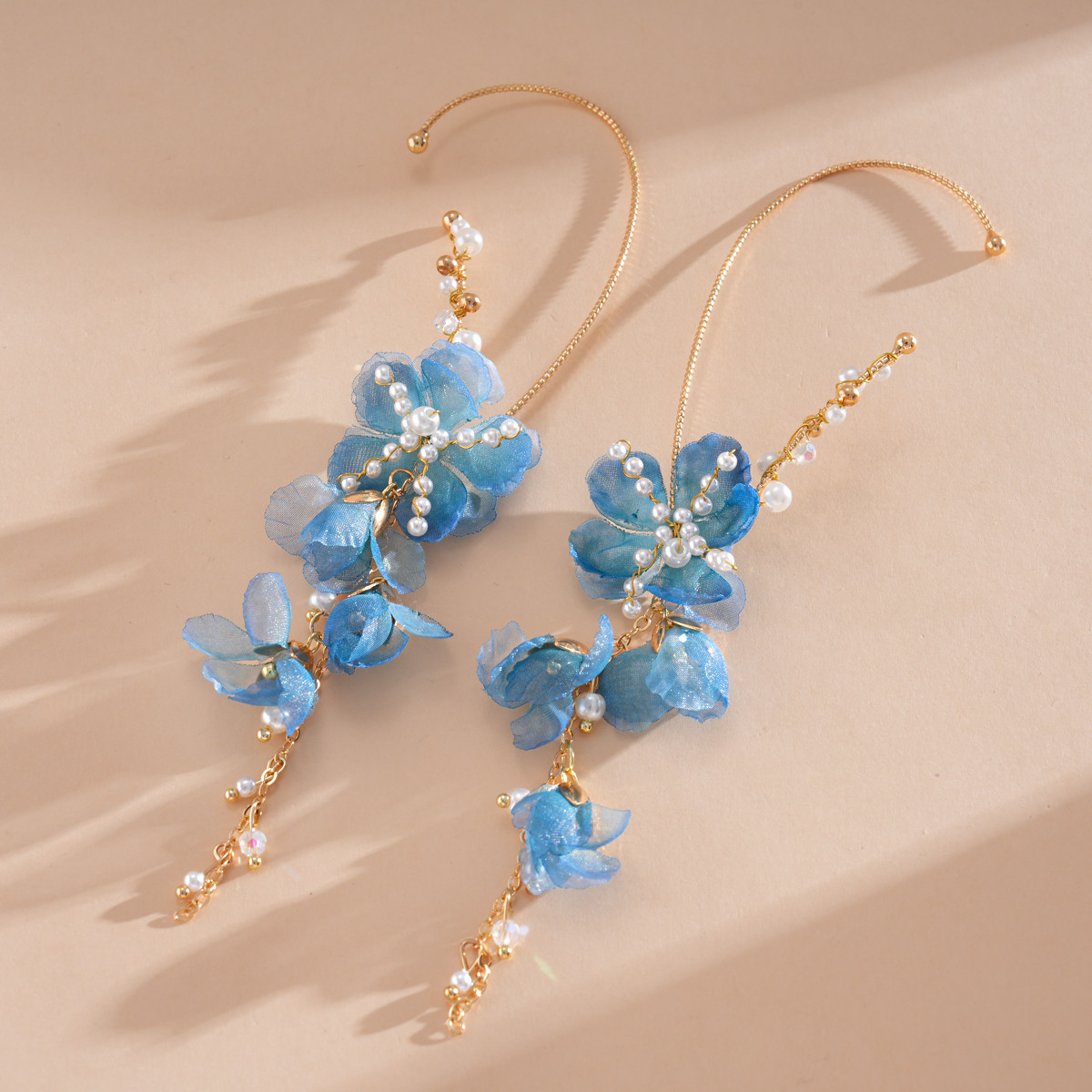 Europa y los Estados Unidos super inmortal vidrio de perla chiffon flor de bordillo personalidad dulce aretes de aretes de vacaciones de mar aretes de viento