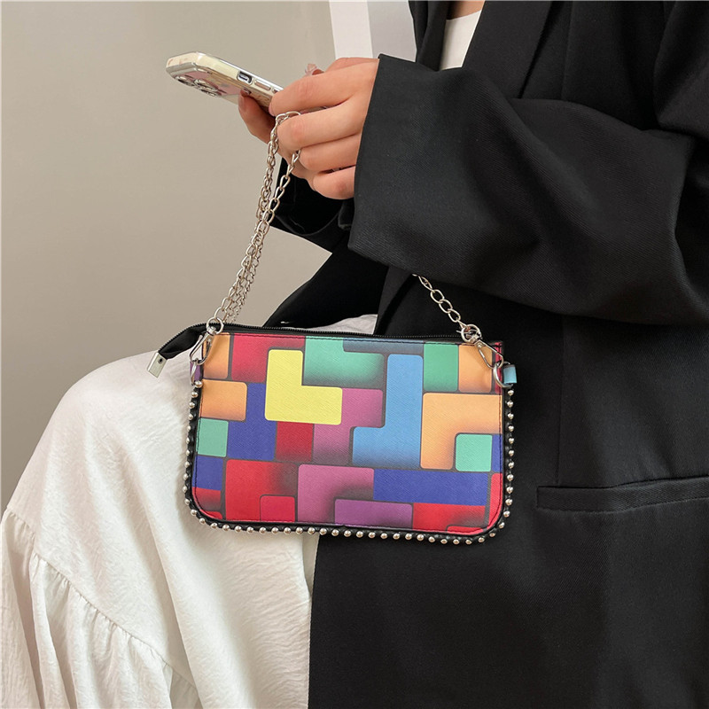 Personalidad de la tendencia de colores bolsos de mujer pintados 2025 nueva cadena de moda bolsos de mano simple bolsos de hombro de moda