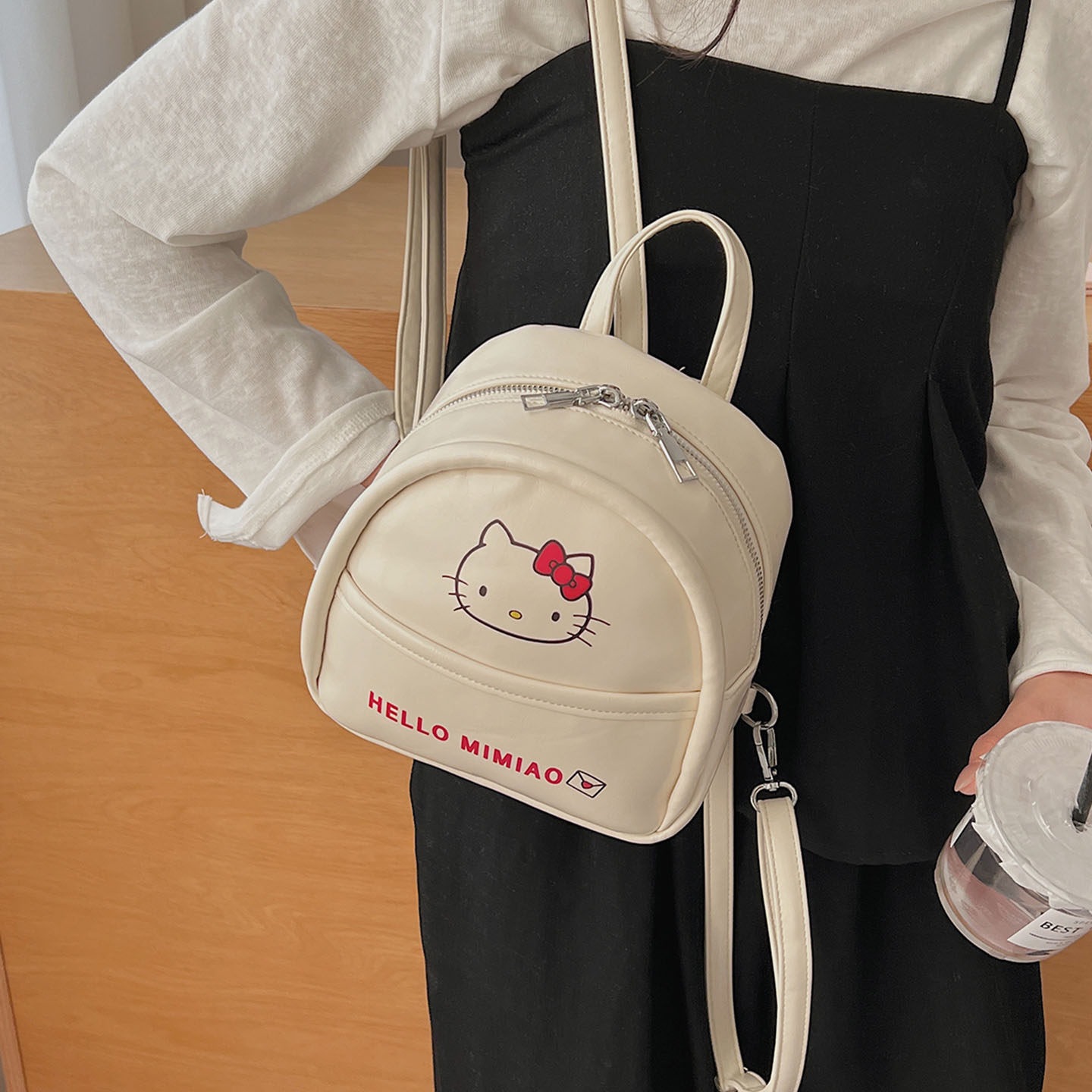 Mochila de moda encantadora mochila de clase de viento mujer de viaje temperamento universal gato 2026 mini niña nueva