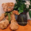 Коричневый медведь с галстуком
