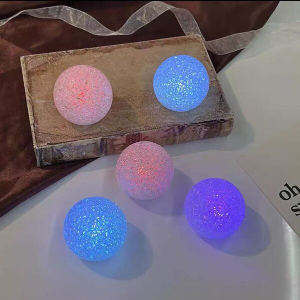 Holding a luminous ball lamp for dance chorus