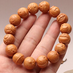 野生の猿の頭のクルミの手の串は猫のブレスレットの桃の核の文に刺してドラえもんの菩提の男女の金の新年の贈り物を遊びます。