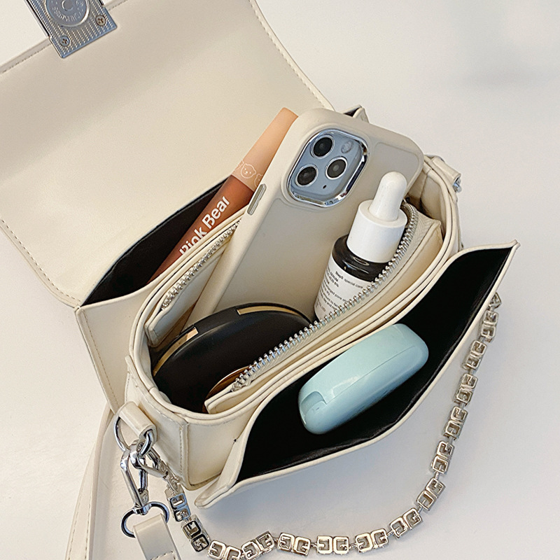 Bolso de moda de nicho de cadena de mano de mujer 2024 nuevo estilo simple popular bolso de hombro pequeño textura mochila