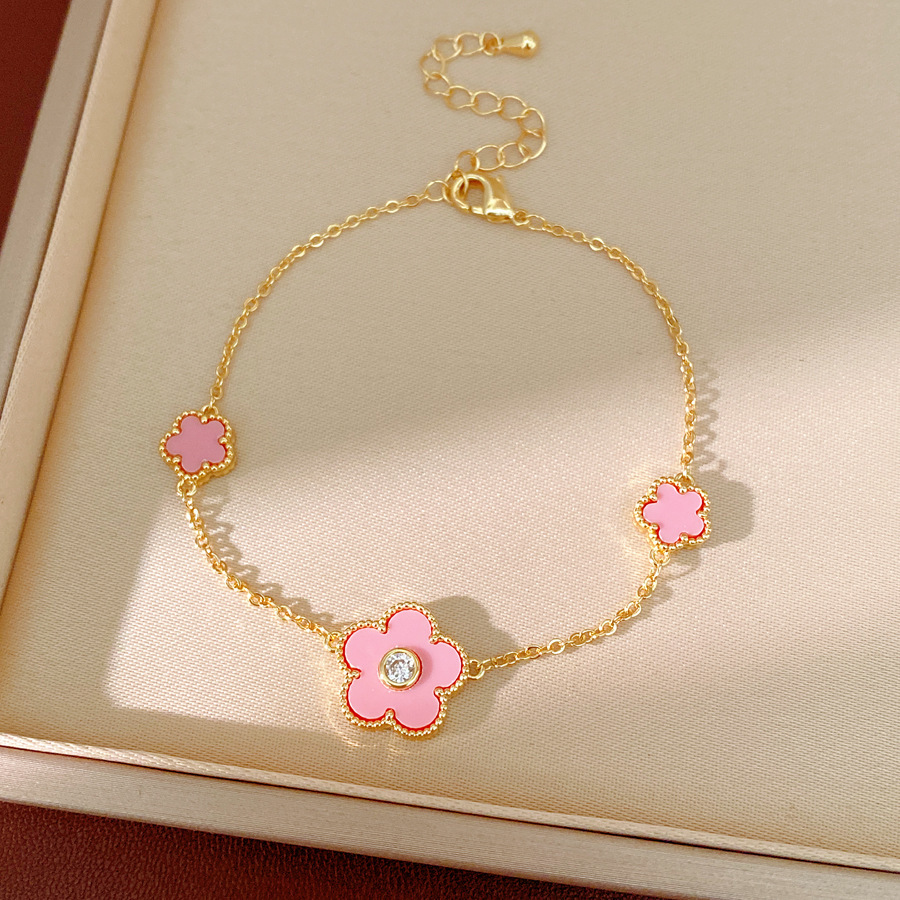 Collar de orejas de piedra de oro real, collar de orejas de flores de lujo ligero, collar de clavícula de nicho, conjunto de joyas simples y dulces.